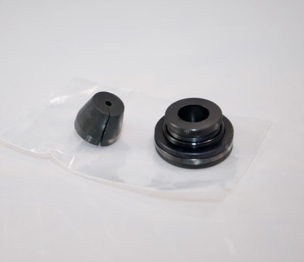 Outex Accessories Miscellaneous Copy: Black metal and rubber camera adaptors in a clear plastic bag on a white surface.