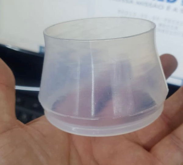 A hand holds an Outex Accessories Miscellaneous Copy cup—perfect for storing small items like cable, camera, or tripod adaptors.