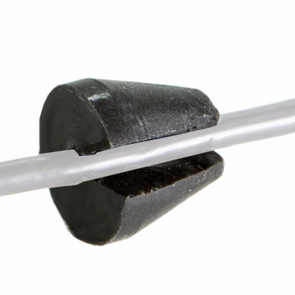 A black Outex rubber grommet with a slit is fitted around a clear tube or cable adaptor, shown against a white background.