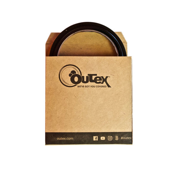 A cardboard box with an Outex front glass inside