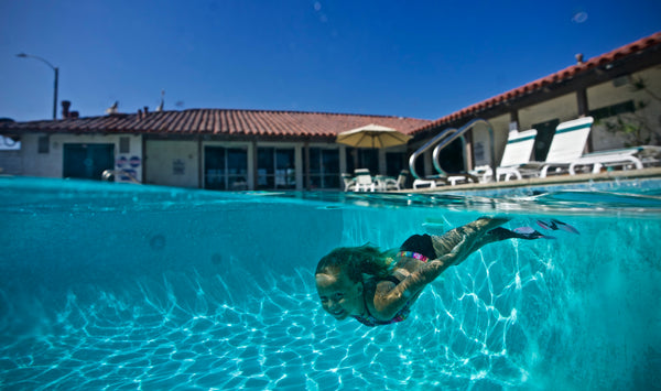 Young Kid Having Fun in Swimming Pool