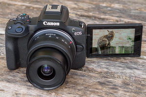 Canon EOS R50 mirrorless camera with Outex waterproof housing system — lightweight universal underwater housing for travel, snorkeling, surf, and adventure photography