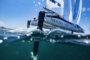Olympic sports photographer capturing action at Tokyo 2020 in the rain using Outex waterproof camera housing