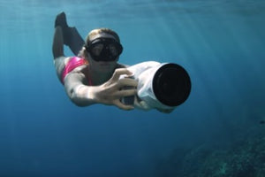 Alison Teal underwater with Outex waterproof camera housing while on adventure filming