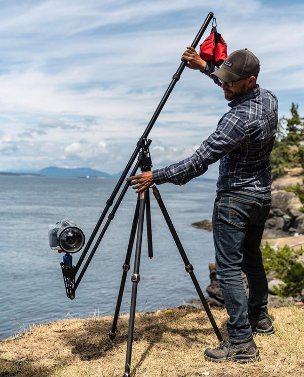 Man Setting up a Tripod Add-on Kit