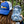 Woman with a blue cap is holding a camera protected by an Outex case