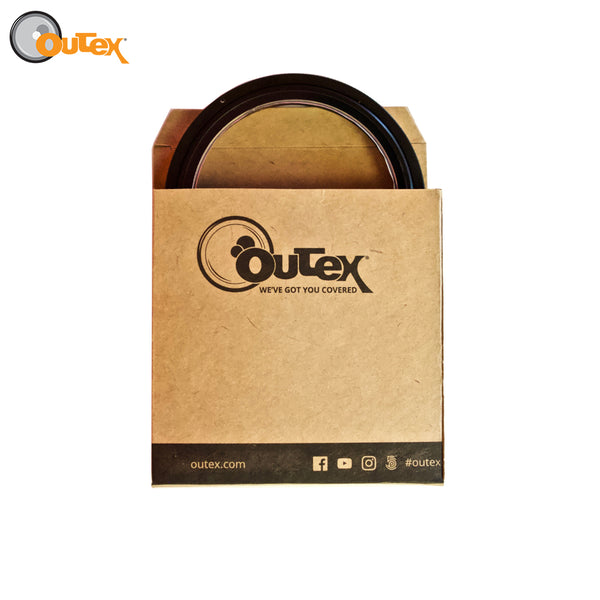 A cardboard box with an Outex front glass inside