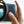 Hand holding a camera that is partially visible